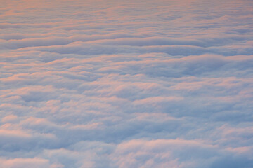 An early morning landscape with the sea of ​​clouds below and the morning sun rising.