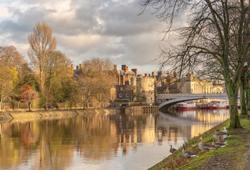 Historic iron bridge and river in winter.