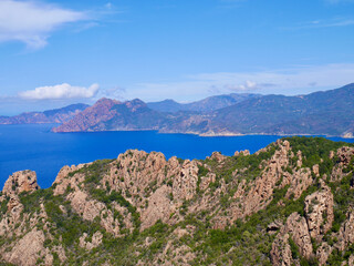Red cliffs of the Calanche, UNESCO world heritage, and the Golf of Porto. Corsica, France.