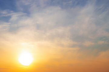 The sun in the winter sky. Background with clouds and sun without horizon.