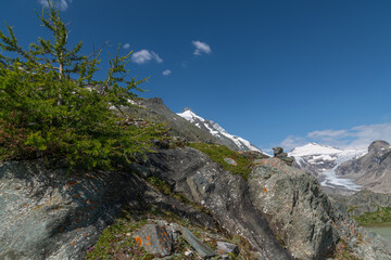 Fototapeta na wymiar Pasterze Glacier lake with Grossglockner Summit and Johannisberg summit with Pasterze glacier