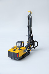 Drilling machine for contour drilling of boreholes for blast preparation in the quarry. The layout of a small quarry drilling rig on a white background.