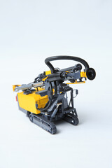 Obraz premium Drilling machine for contour drilling of boreholes for blast preparation in the quarry. The layout of a small quarry drilling rig on a white background.