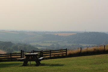 picnic basket with a view. scenic view with fog. 