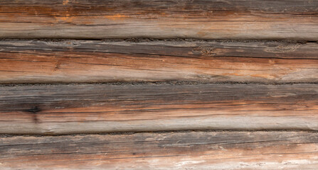 Fototapeta premium Old grey and brown wooden background with cracks and scratches in vintage style