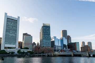 Fototapeta na wymiar Panoramic picturesque city view of Boston Harbour at day time, Massachusetts. An intellectual, technological and political center. Building exteriors of financial downtown.