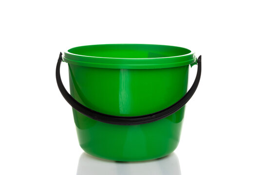 empty plastic green bucket with black handle on white isolated background