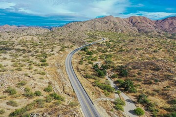 Aerial view of the landscape of the Sonoran desert in the horizer, mountains and lines of the highway lanes in the municipality of Imuris, Mexico. drought, lack of water in the region