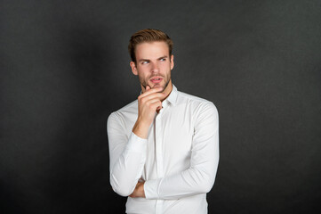 young guy in white shirt on black background, fashion