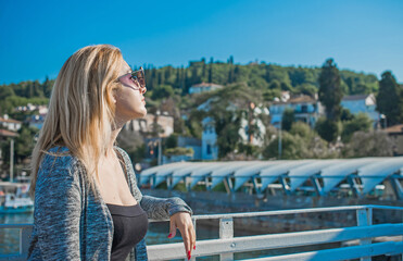Obraz premium Travelling concept. Modern beautiful woman at Princes Islands, vacation in Istanbul. 