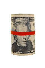 $20 American dollar bills rolled up and held together with a red rubber band covering Andrew Jackson’s eyes. Isolated on white background.
