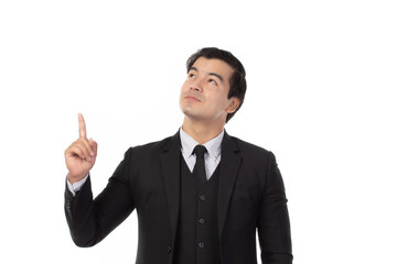 Portrait of a confident business man in black suit smile and pointing to copy space isolated on white background. Portrait business concept.