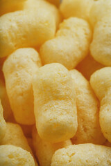 Yellow dessert Corn sticks in powdered sugar texture.