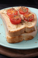 Bread with cheese, tomatoes and oregano