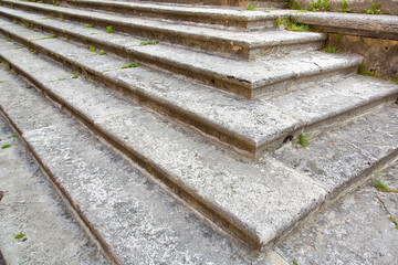 Eliminating or overcoming architectural barriers in public buildings or private buildings open to the public - old chiseled stone staircase with stone blocks