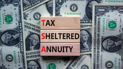 TSA, tax sheltered annuary symbol. Concept words TSA, tax sheltered annuary on wooden blocks....