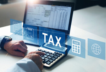  Tax and Vat concept. Businessman using the laptop to fill in the income tax online return form for...