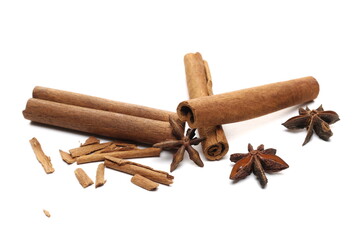Star anise and cinnamon stick and pieces isolated on white  