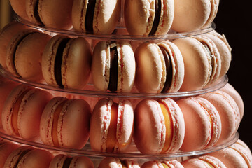 French macaroons. Candy bar. Wedding feast. Wedding sweets. beautiful macaron cake patisserie multi tier stand full of pastel macarons. pyramid tower