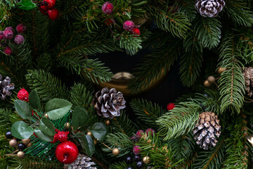 Selective shot of decorations, toys and lights on decorated christmas tree. Selective focus. Blurred
