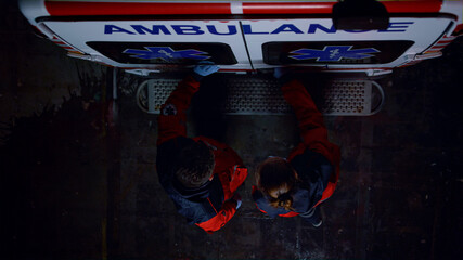 Paramedics closing doors of ambulance car. Emergency doctors finishing work  © stockbusters