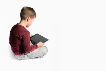 boy playing tablet. white background