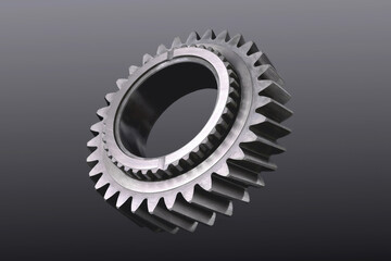 Cogwheel. Car gearbox gear. Detail of transmission of rotation of mechanisms. Gray background,...