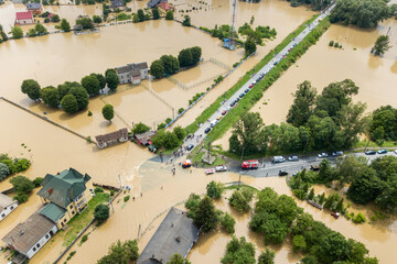 Aerial view of flooded houses and rescue vehicles saving people in Halych town, western Ukraine
