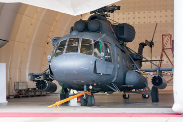 Heavy military helicopter in the hangar © Dushlik