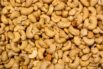 Lots of cashew nuts. Dry cashew nuts top view background or texture. Nut background.