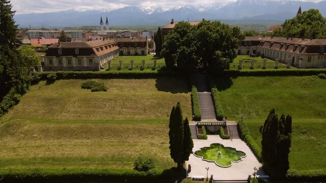 Aerial footage of Brukenthal summer garden, located in Avrig, Sibiu county Romania. Video was shot from a drone, picking altitude while flying backward and tilting the camera down revealing the garden