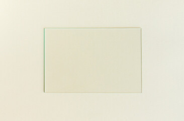 Empty picture frame on a plain background. Blank poster mockup for art display. Pastel color background.