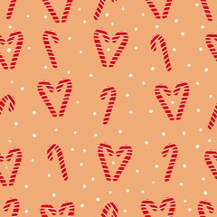 Christmas pattern. cute caramel canes and snow. light orange background. vector illustration. fashionable print for packaging.
