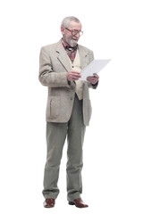 smiling elderly man reading a business document.