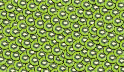 Background of fresh sliced kiwi slices. Bright juicy fruit background. Summer mood. Large texture. Food and healthy lifestyle concept.