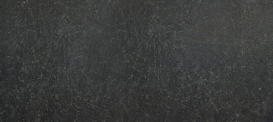 Obraz premium Black or dark gray rough grainy stone texture background