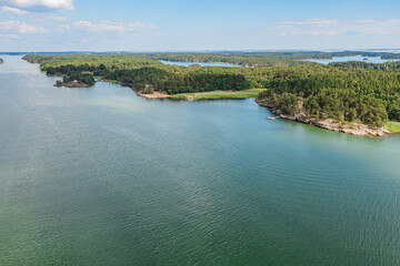 Photo from a drone, on a sunny summer day, a view of the islands in the sea. Finland, Turku. Nature and landscape of Scandinavia