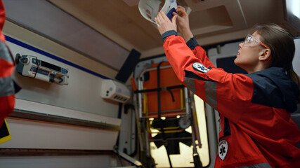 Team of emergency medical service going for 911 call in ambulance car © stockbusters