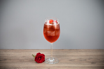 glass of rose wine with cherry