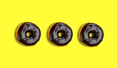 Tasty sweet donuts for Hanukkah on color background