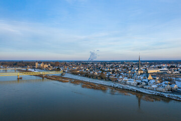 The banks of Sully sur Loire and its town center under the snow in Europe, in France, in the Center...
