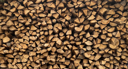 Warehouse or stack of firewood for starting a fireplace or heating a house, stock for the winter, source or template