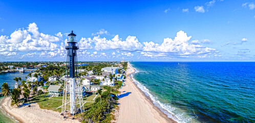 City of Hillsboro Beach, Florida with lighthouse on beach and ocean - Powered by Adobe