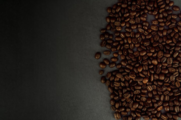Close Up of Coffee Beans on Dark Background Right Justified with Copy Space