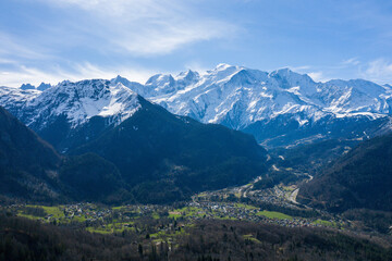 Fototapeta premium The mountain town of Les Houches in the Mont Blanc massif in Europe, France, the Alps, towards Chamonix, in spring, on a sunny day.