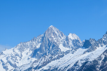 The Aiguille Verte and the Aiguille du Dru in the Mont Blanc massif in Europe, France, the Alps, towards Chamonix, in spring, on a sunny day.