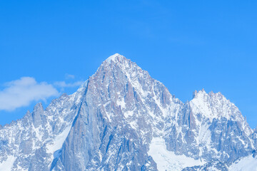 Fototapeta na wymiar The close-up on the Aiguille Verte and the Aiguille du Dru in the Mont Blanc massif in Europe, France, the Alps, towards Chamonix, in spring, on a sunny day.