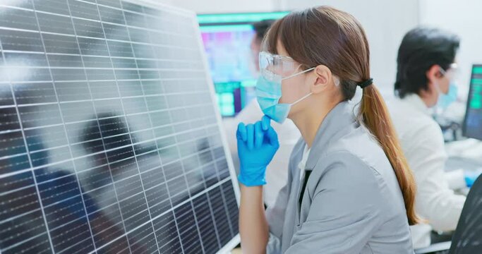 asian engineer with solar panel