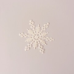 Christmas snowflake decoration with bright background. Minimal concept.