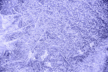 blue tint with purple undertone ice patterns on winter glass, ice crystals. abstract background frost close-up Very Peri